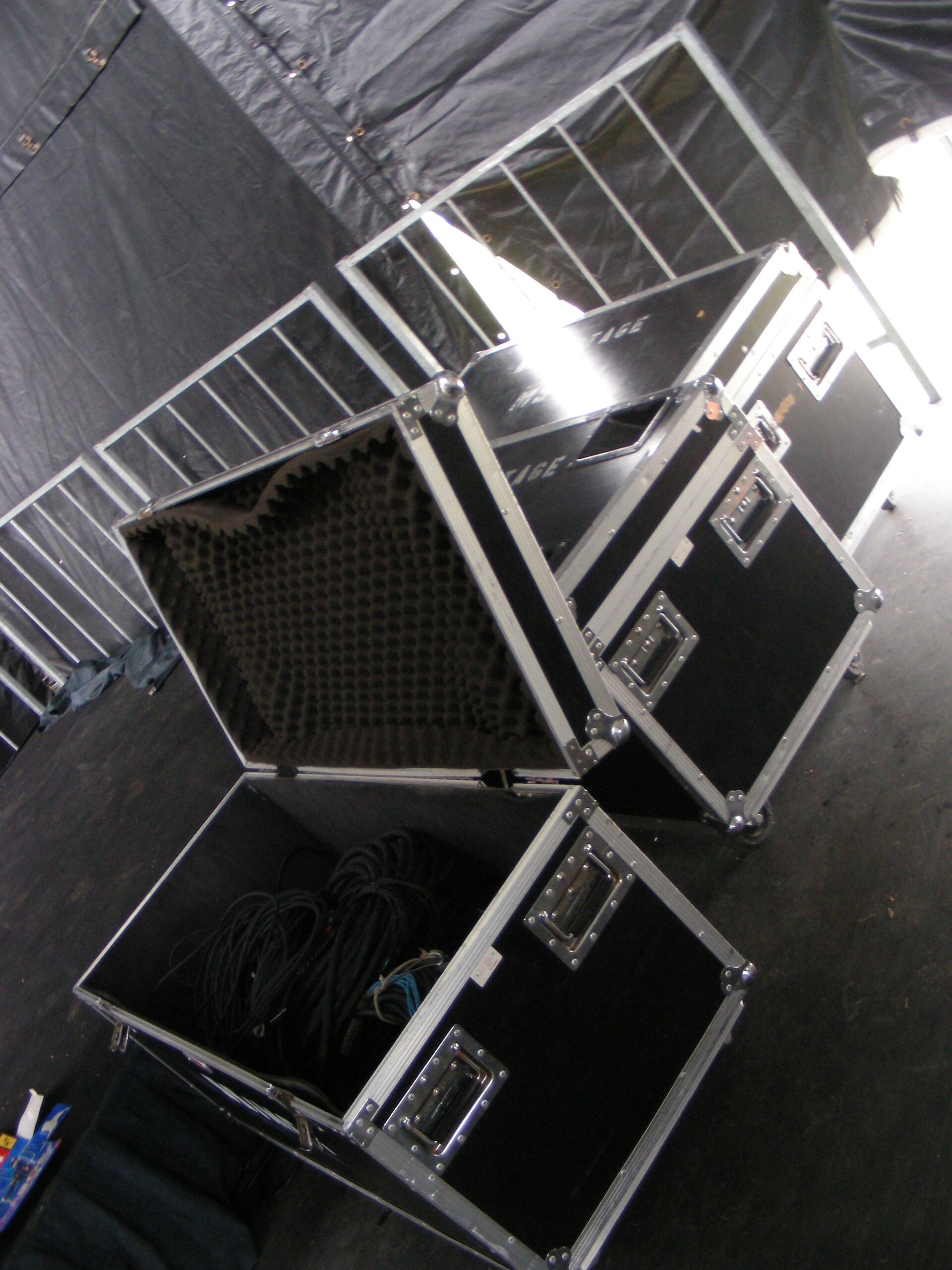 Open road cases backstage on a 2007 club tour